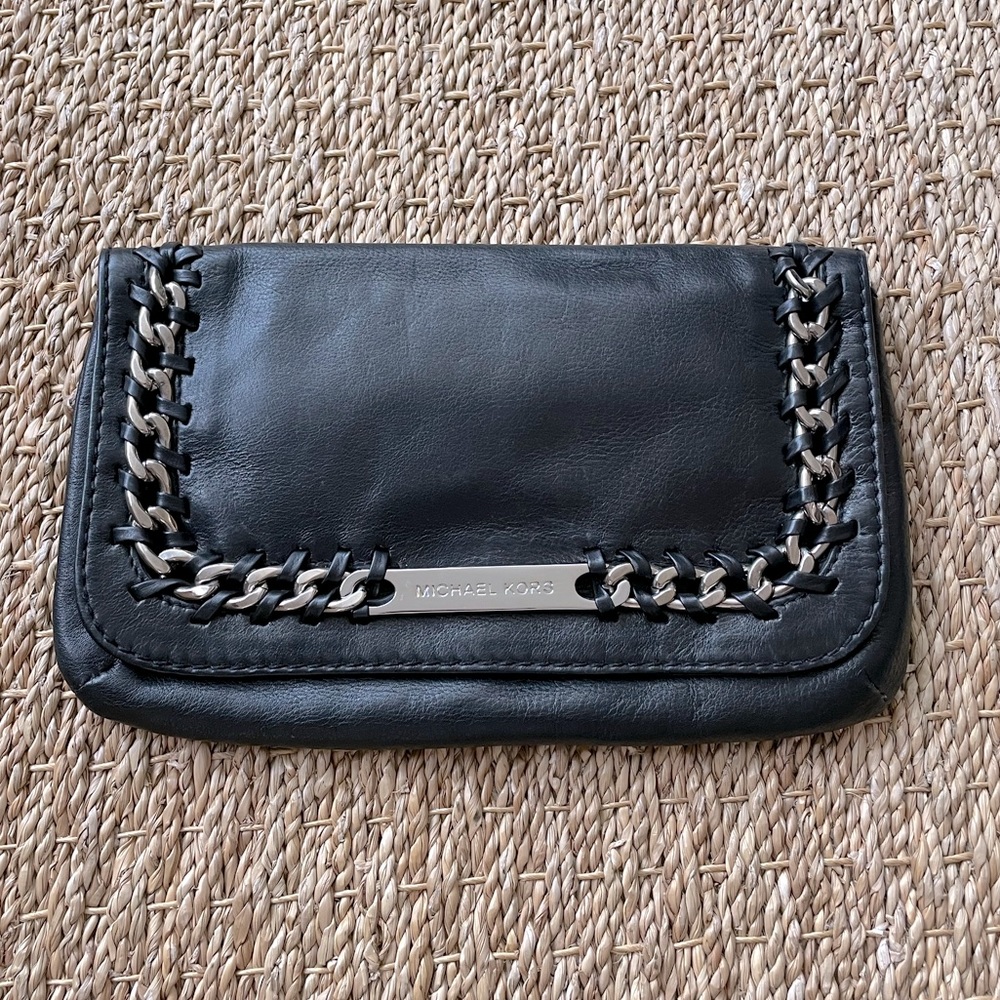 Michael Kors. Black leather evening clutch. Black leather & silver hardware.